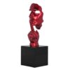 statue visage doigt rouge chut